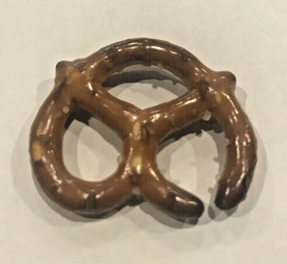ERROR PRETZEL OPENING WAS LIKELY BURNED WHEN ORIGINALLY MADE