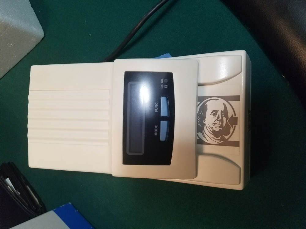 U.s. dollar counterfeit detector