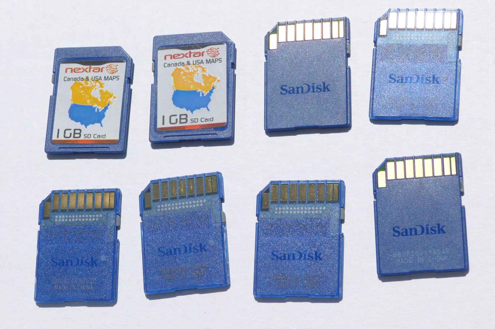 One (1) - genuine Sandisk 1GB SD card with Nextar gps USA & Canada maps