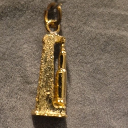 Vintage gold-tone Space Shuttle launch pad charm