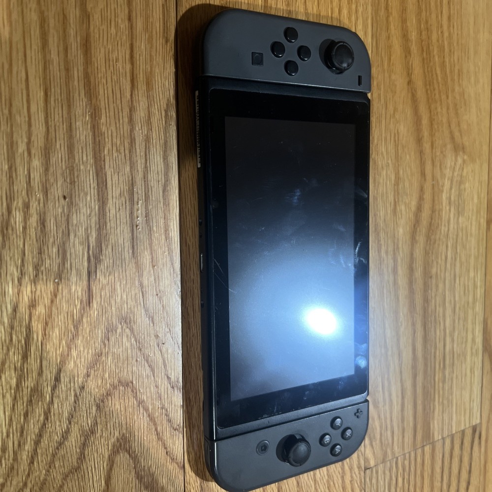 Nintendo Switch Console W/ Dock, Joycon Grip, & Joycons “READ”