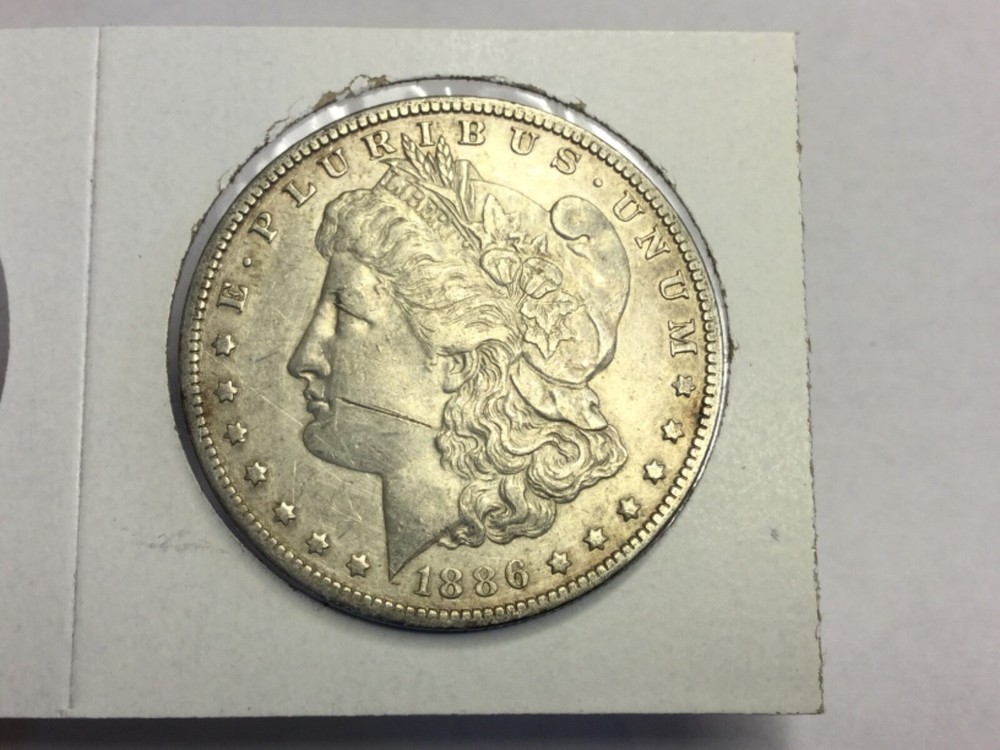 1886-O Morgan Dollar in almost uncirculated