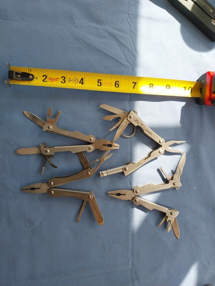 4 small multitudes with pliers knife scissors screwdriver's