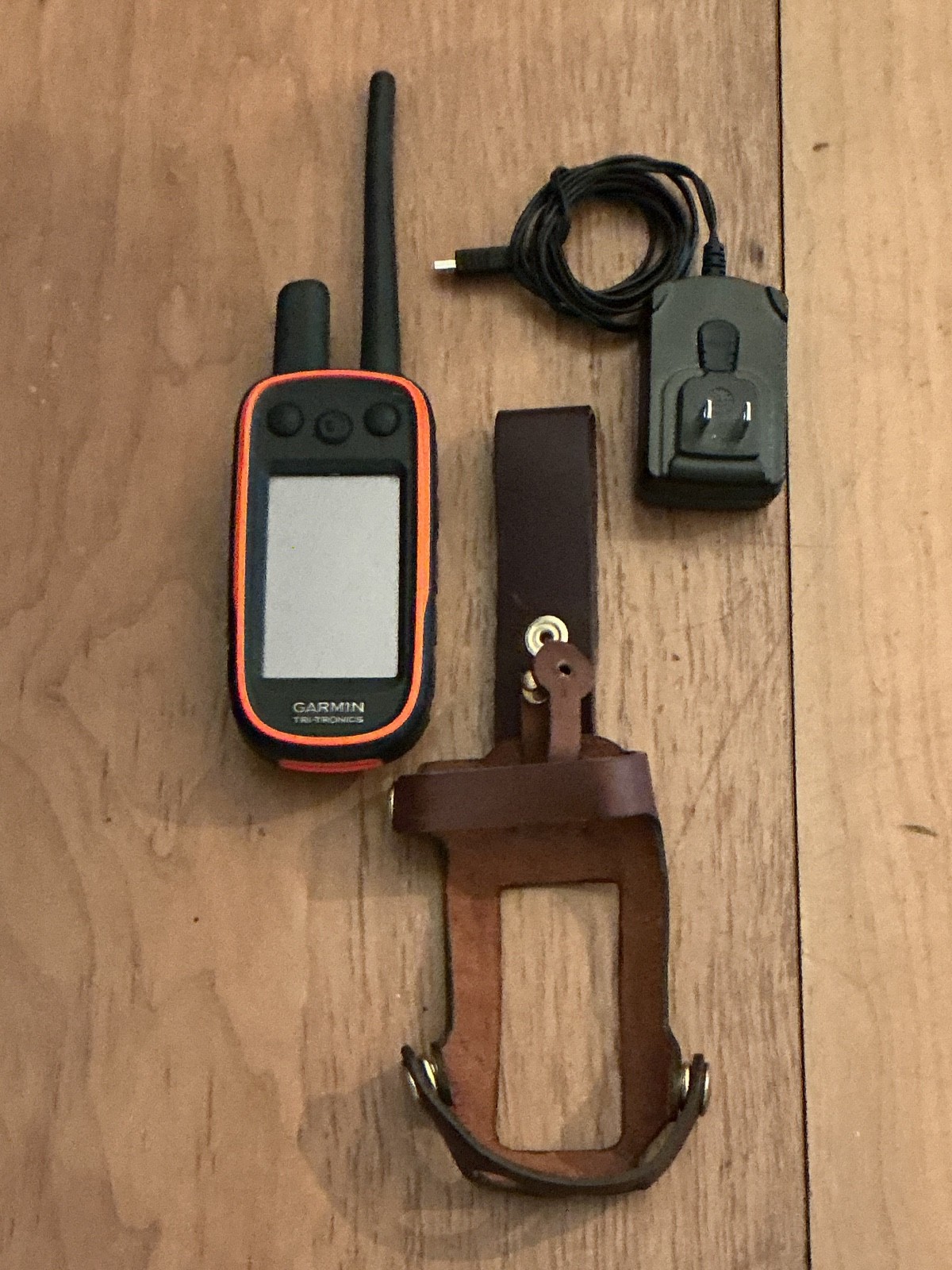 Garmin Alpha 100 GPS Dog Track and Train Handheld with leather case.