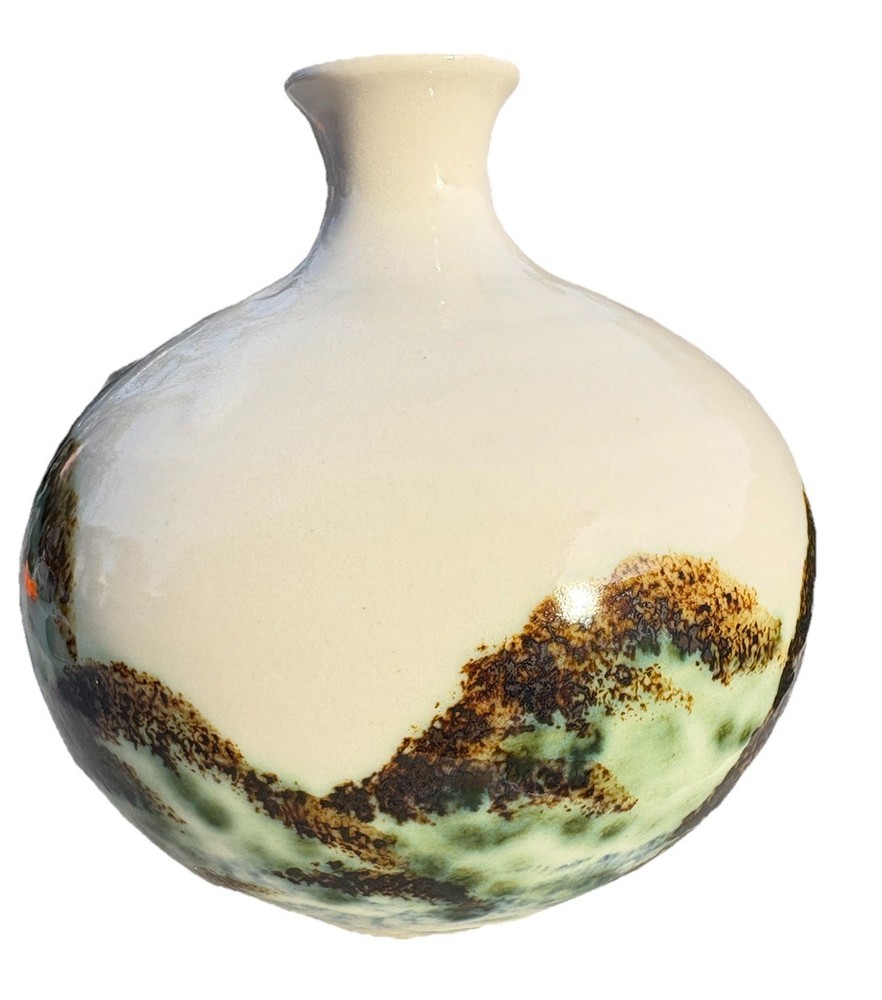 ceramic vase with an "Evergreen" design, featuring a water etching