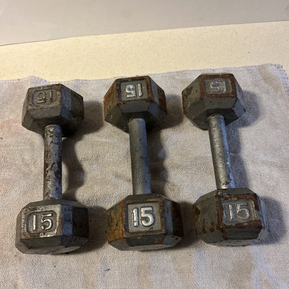 Three 15 Pound hex Head Cast Iron Dumbbells Silver