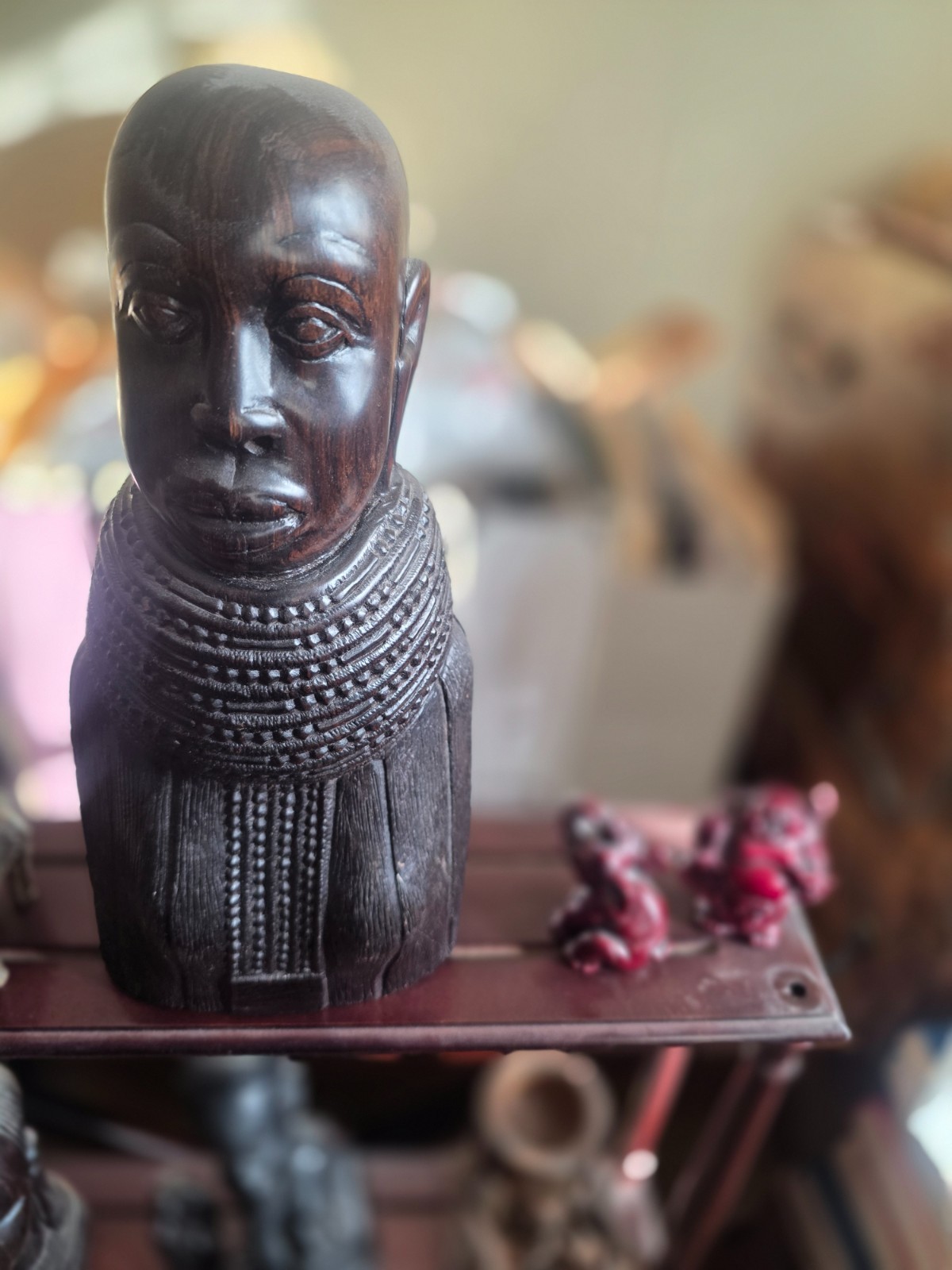 Set of carved statues from black wood, stone, bronze.