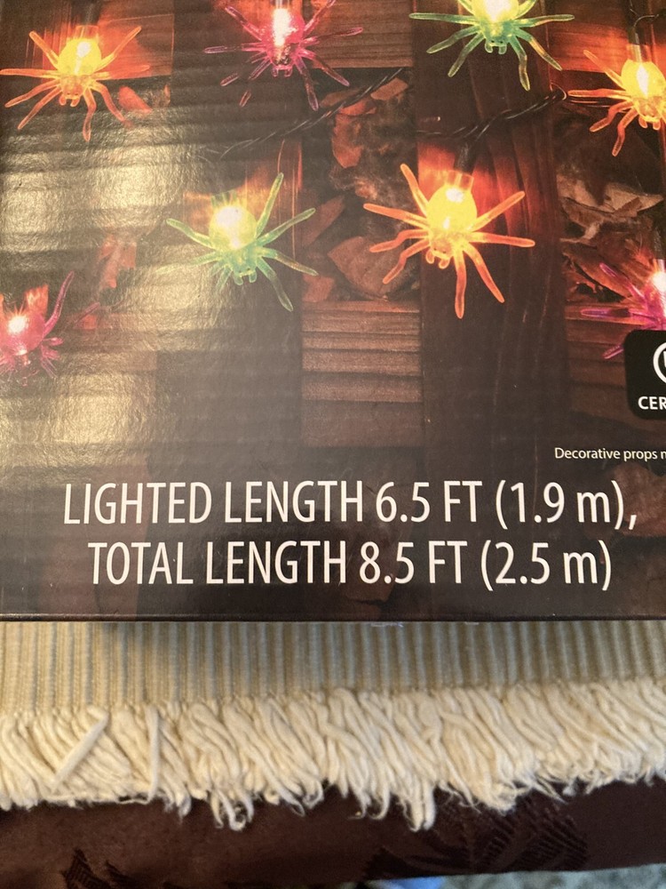 new in the package halloween multi-color spider string lights 6.5 length,