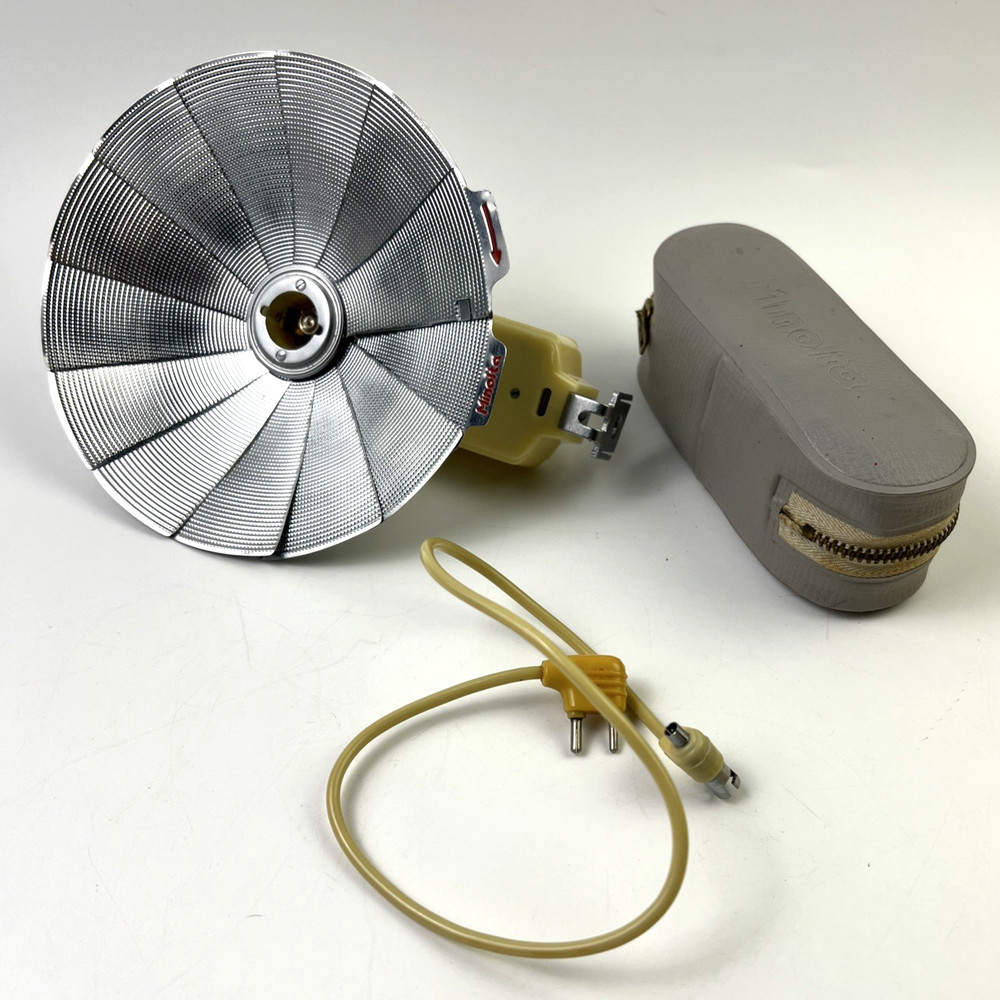 Minoltas JUNIOR? FLASH W/ GUIDE, Cord And Case Untested