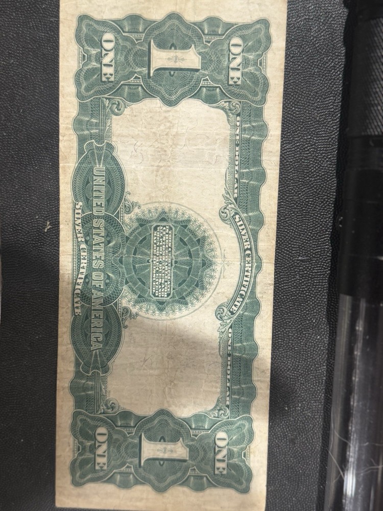 This is an 1899 $1 Silver Certificate, also known as the "Black Eagle" note.