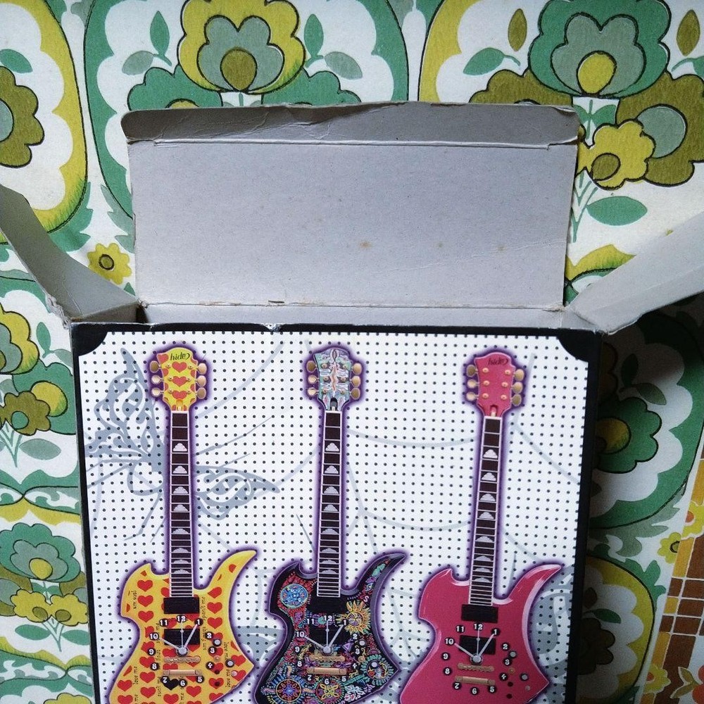 hide guitar wall clock pink
