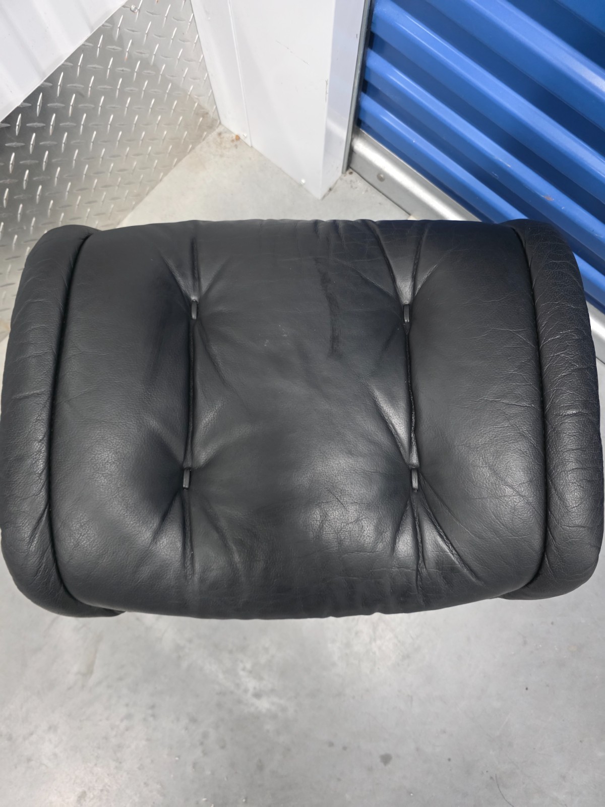 Ekornes Stressless Black Colored Leather Ottoman | Teak Stained Wood Base