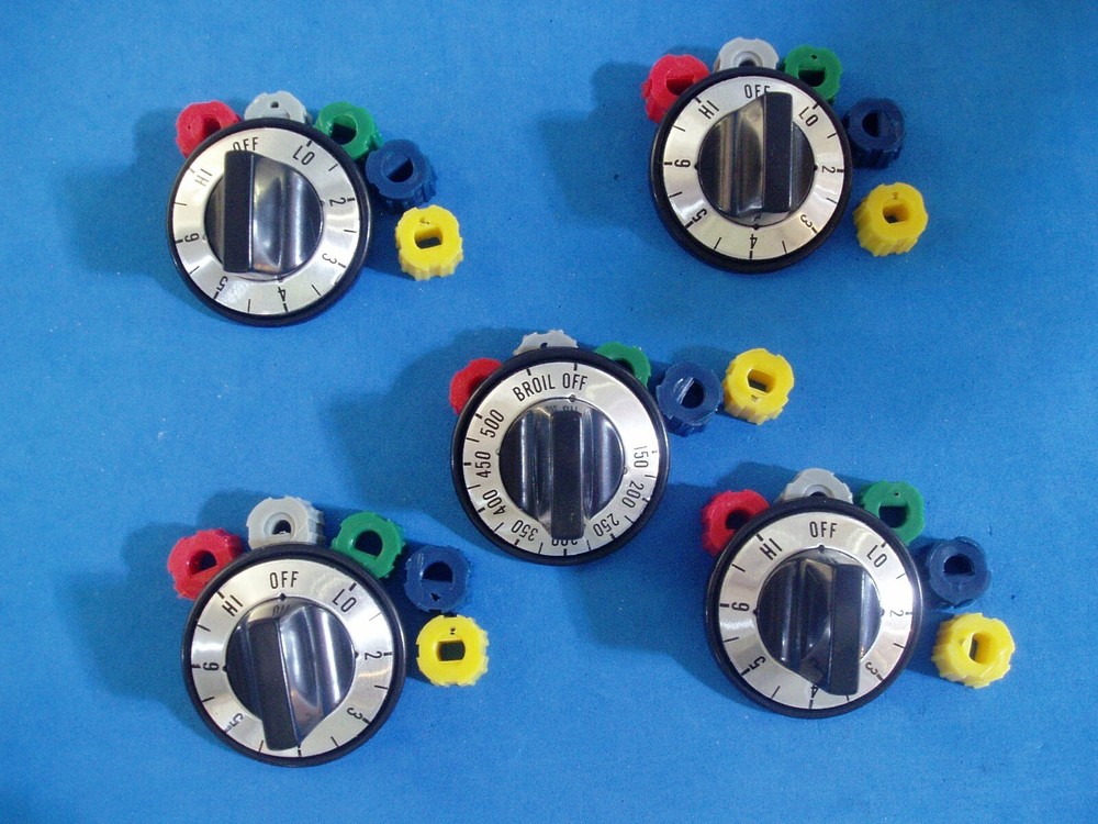 LOT OF FIVE REPLACEMENT ELECTRIC SURFACE RANGE KNOBS