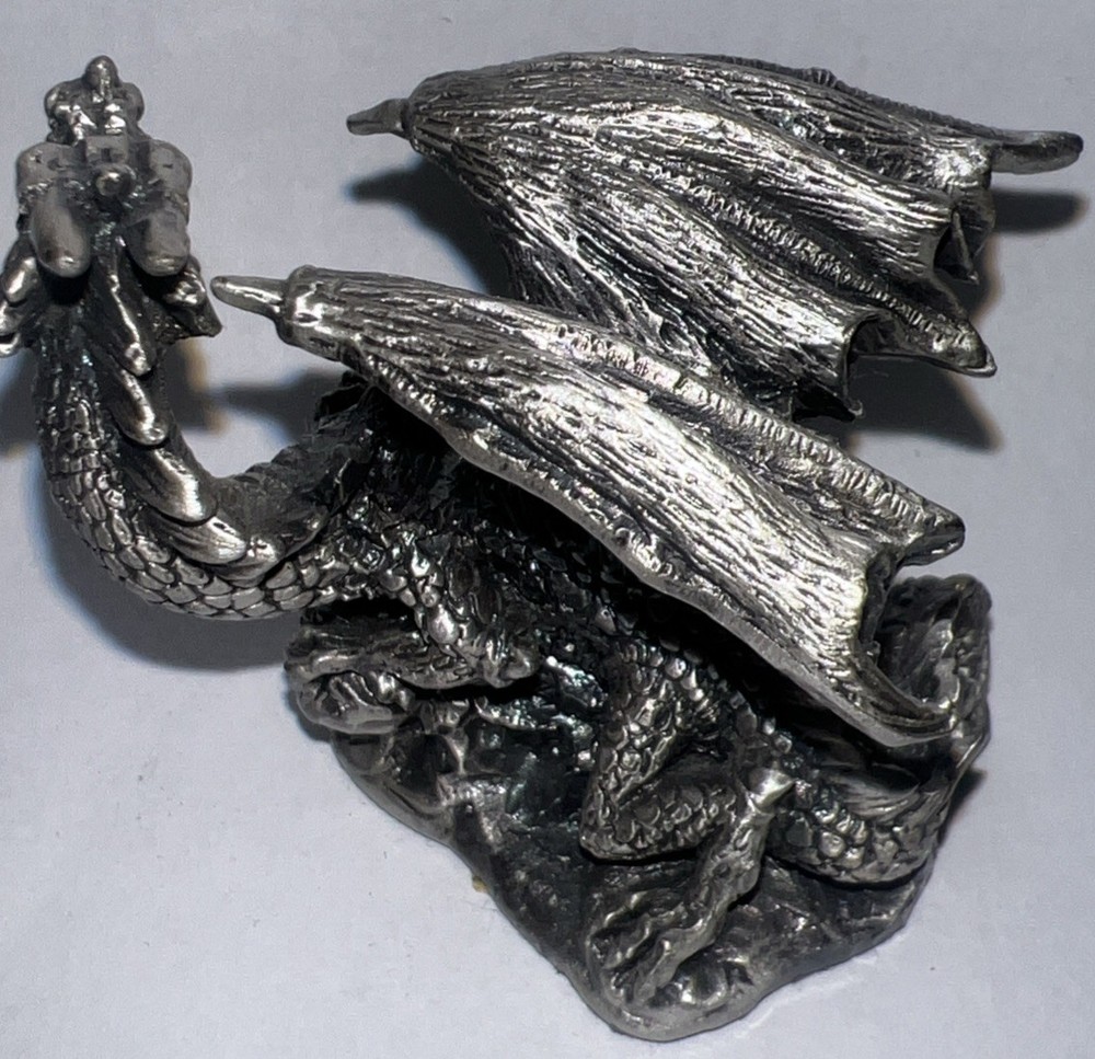 DRAGON SITTING HOLDING CRYSTAL BALL