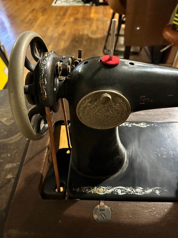 Singer Manufacturing Co. sewing machine with hideaway work station