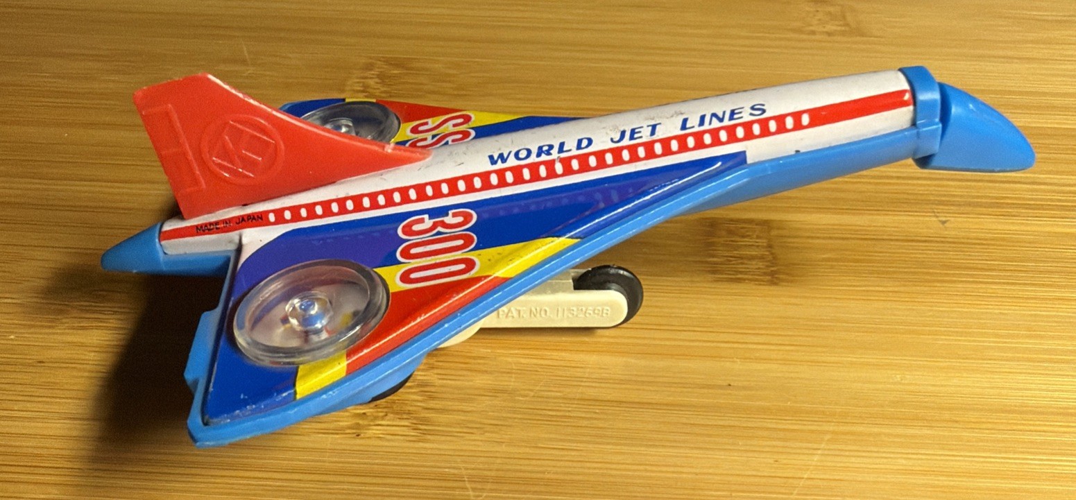 VINTAGE SPARKING SST 5" JET PLANE FRICTION POWERED METAL TOY JAPAN