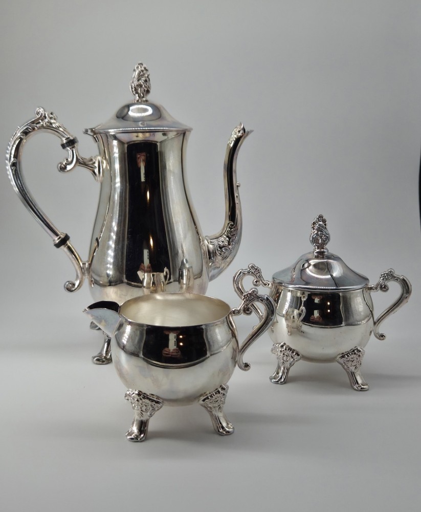 Vintage Elegance Silver Plate Tea Set 3pc Teapot Sugar Creamer EP Brass Footed