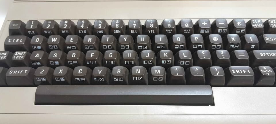 Vintage Commodore 64 computer in box, manuals and programs package