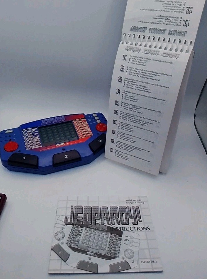 Tiger Electronics Jeopardy Hand Held Game 1995 with Answer Book & Manual