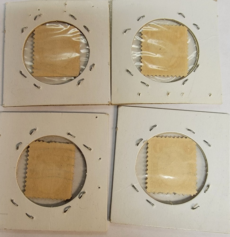 4 OLD POSTAGE STAMPS E135