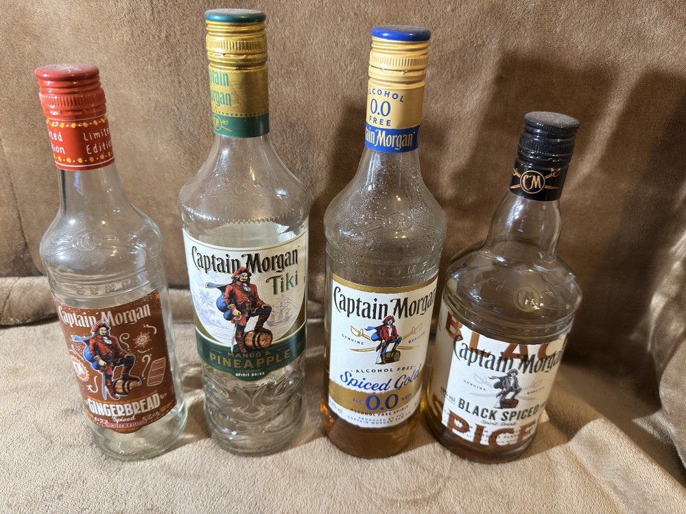 4 EMPTY RUM BOTTLES CAPTAIN MORGANS