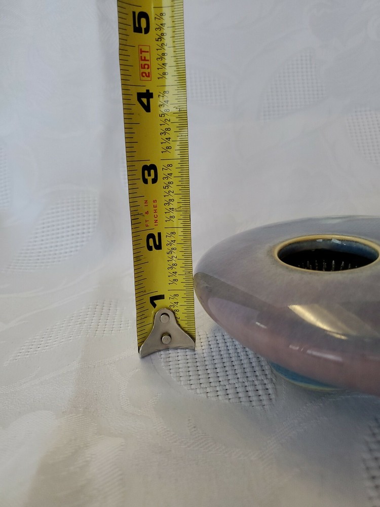 Ceramic single flower bud display vase.