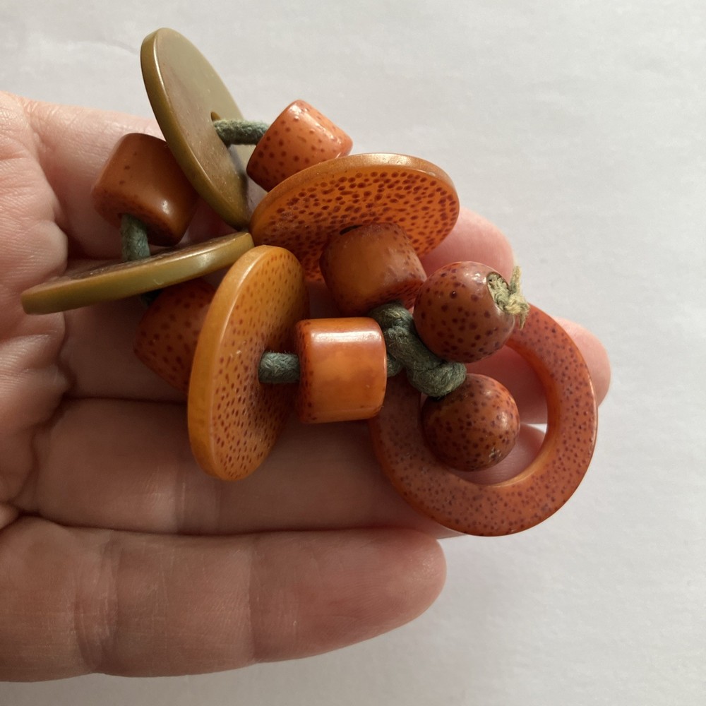 1940’s Orange Green Speckled Bakelite Ring Crib Toy Teething Ring String