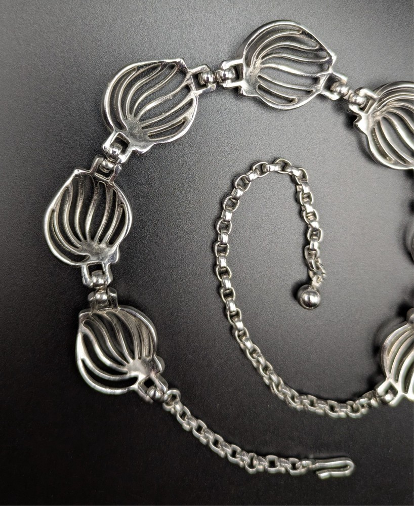 Silver-Toned Bracelet and Necklace Set Featuring Abstract Leaf Patterns