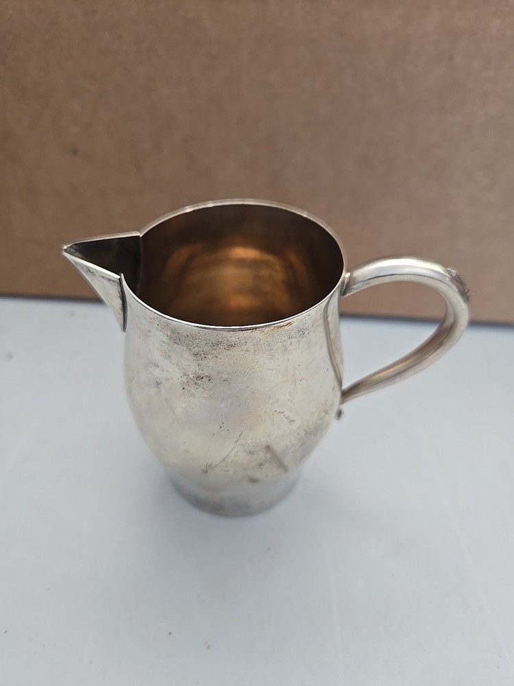 Oneida Silversmiths Sleek Design Creamer.