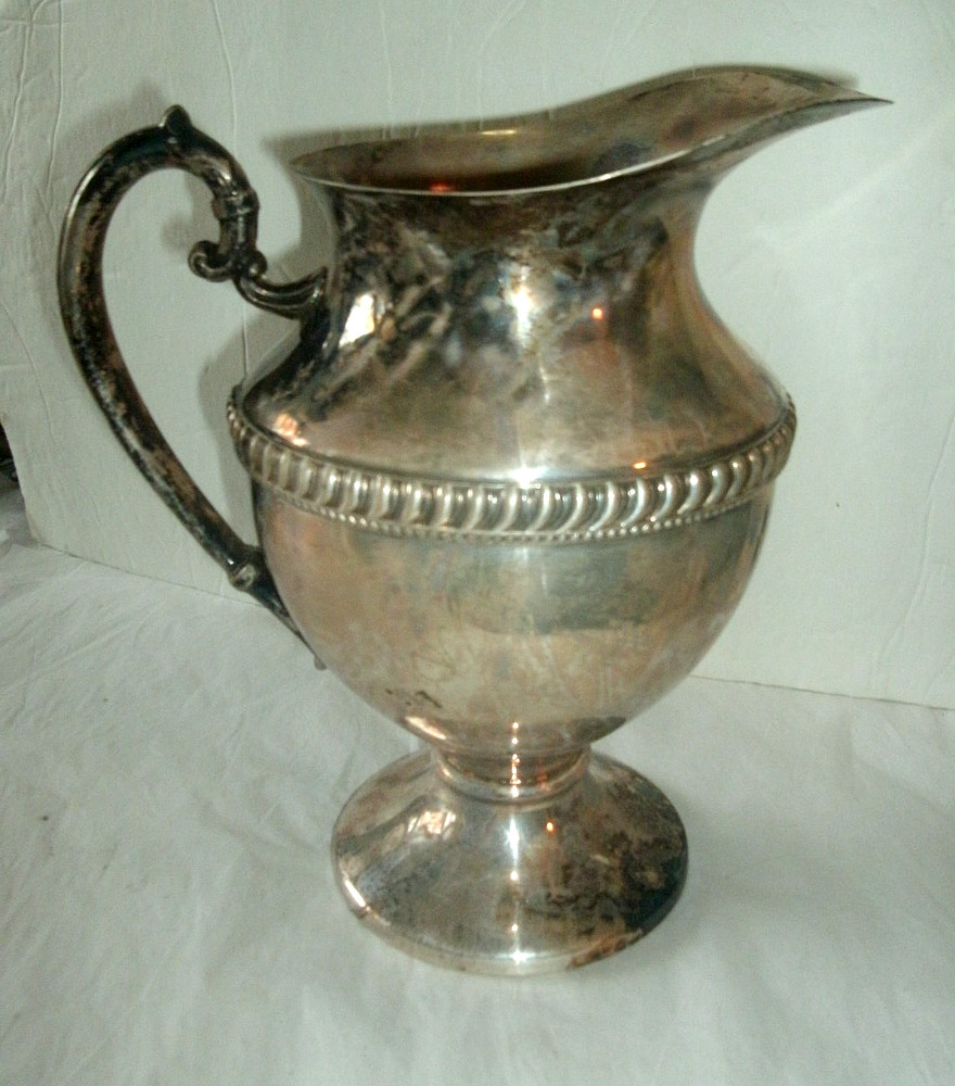 VINTAGE SILVER ON COPPER PITCHER, ENBLEM ON BOTTOM, 9 1/2" TALL