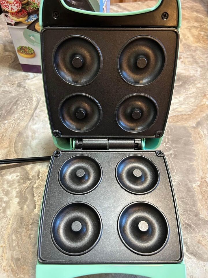 Nostalgia mini donut maker.  Makes 4 donuts per batch.  (Mint Green)
