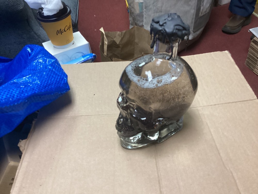 Skull with glitter water globe glass