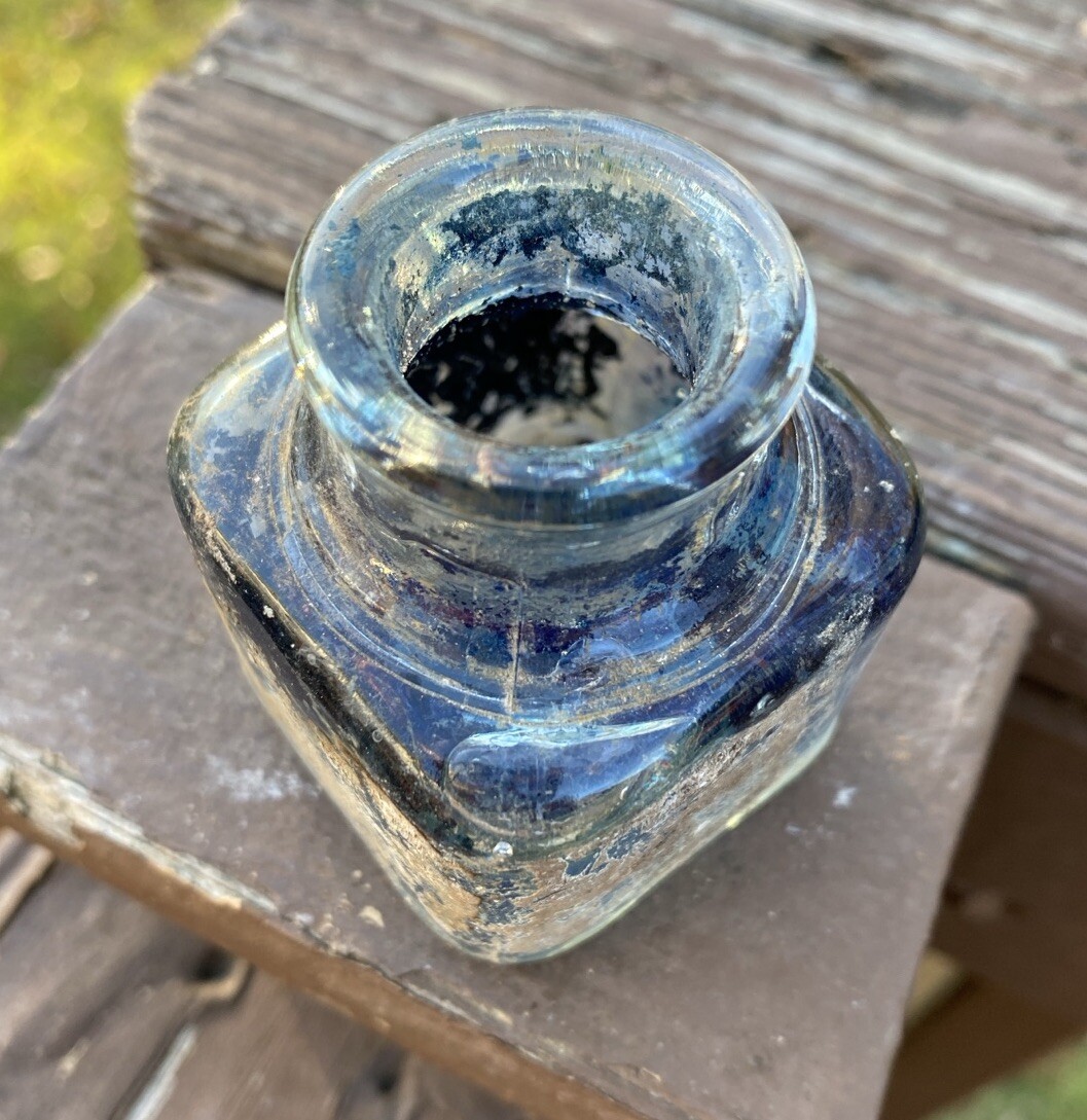 Clear Inkwell With Blue Ink And Partial Label