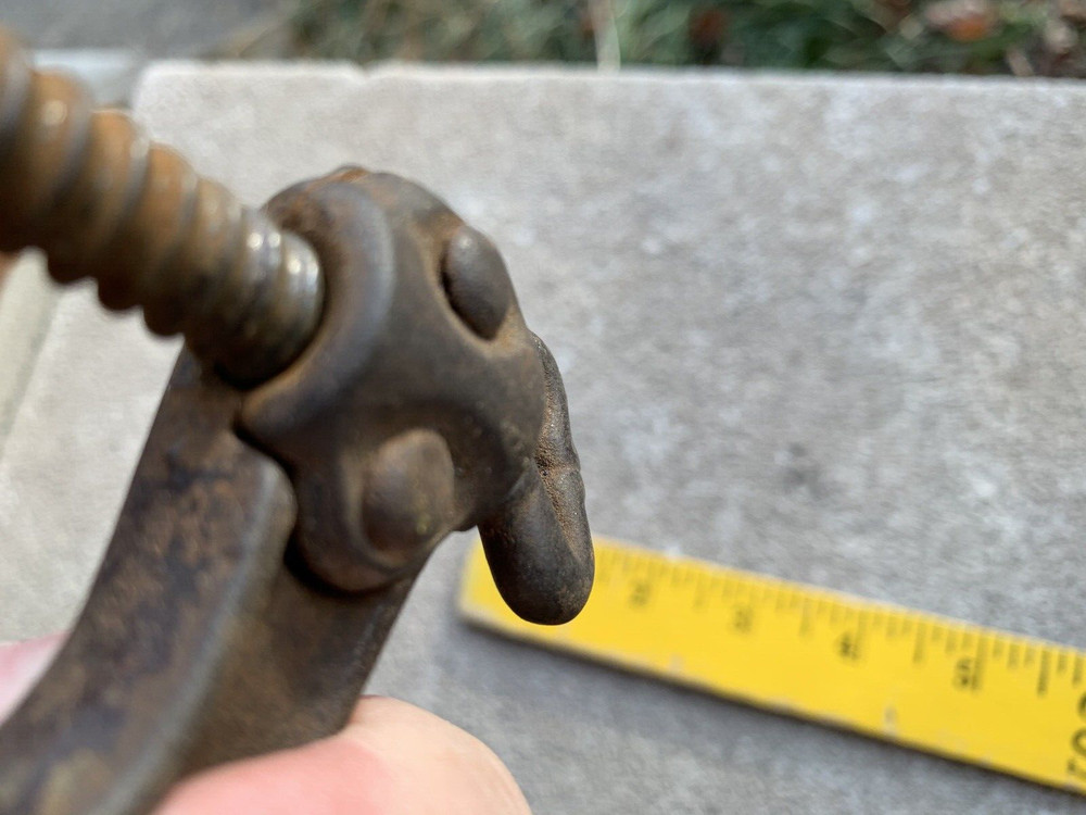 Small iron clamp held together with pins