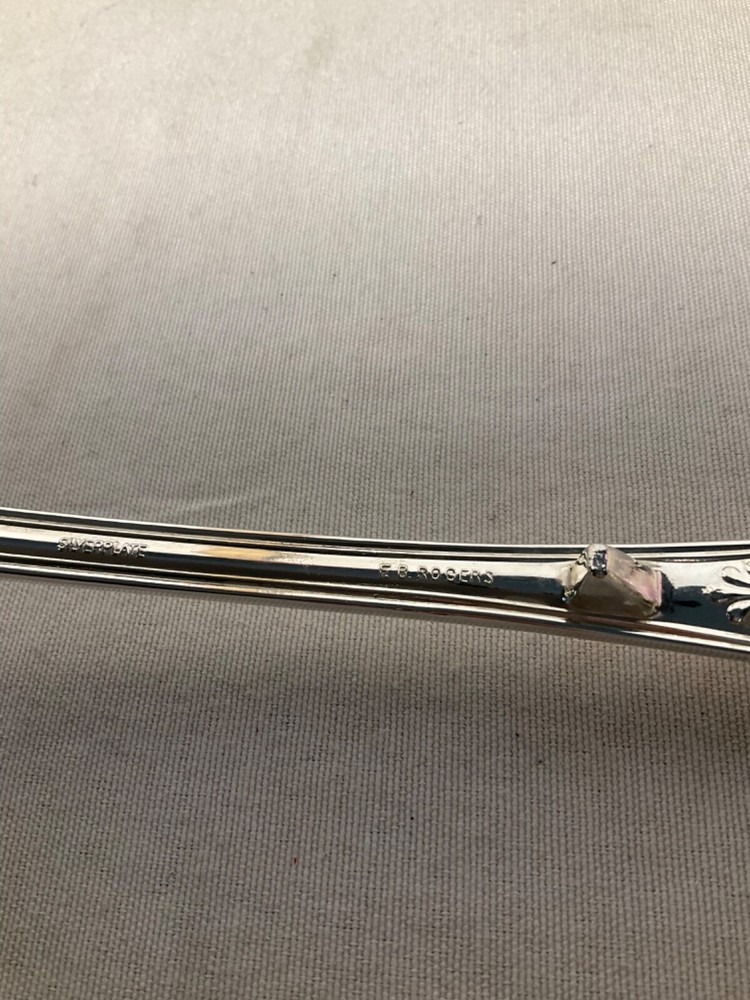 E B Rogers soup ladle silverplate attached rest 10”