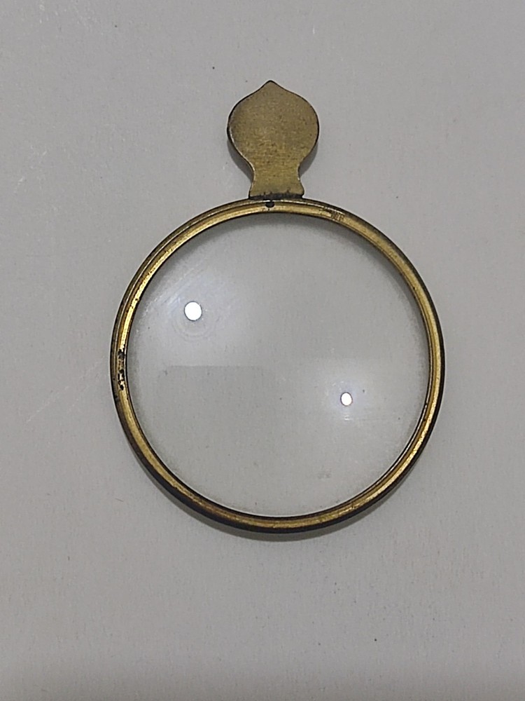 Antique magnifying glass.