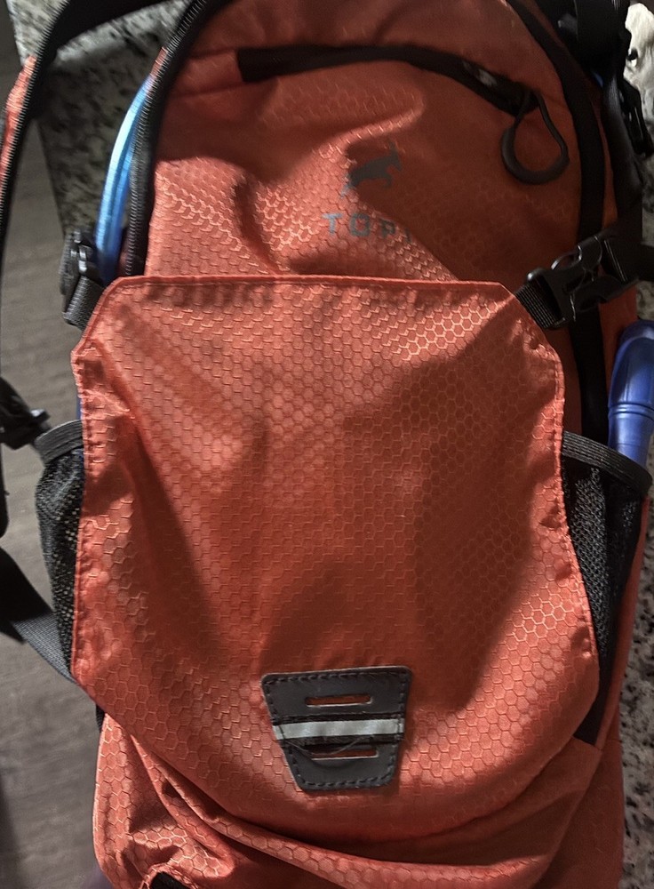 Topi Orange Hiking Hydration Pack Padded Straps, Ventilated Back, 3 Pockets