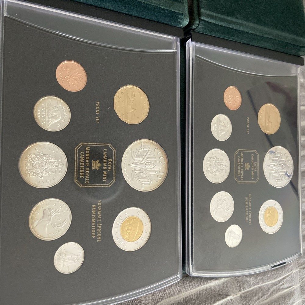 Two 2000 CANADA PROOF SETS WITH COMMEMORATIVE SILVER DOLLARS RCM