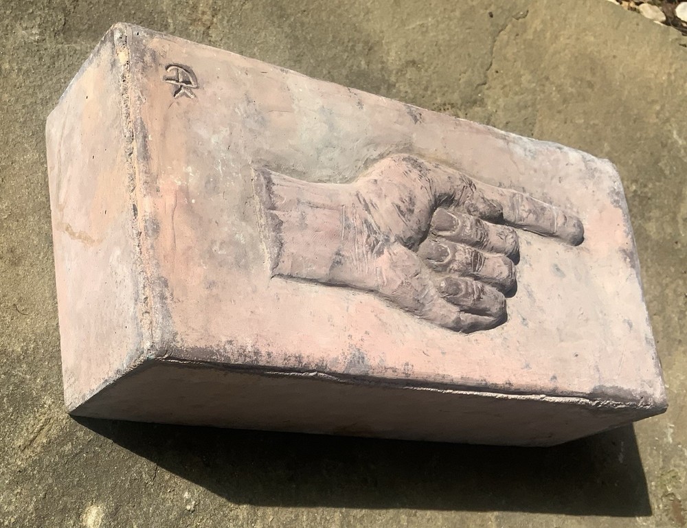 Brick With Pointing Hand