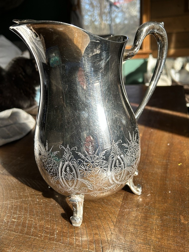Vintage Leonard silver-plated pitcher with engraved floral pattern.
