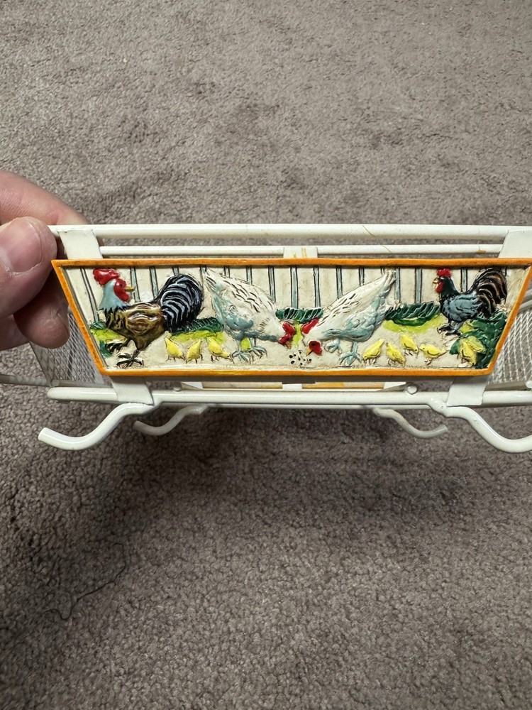 rooster-themed ceramic baker with a wire carrier