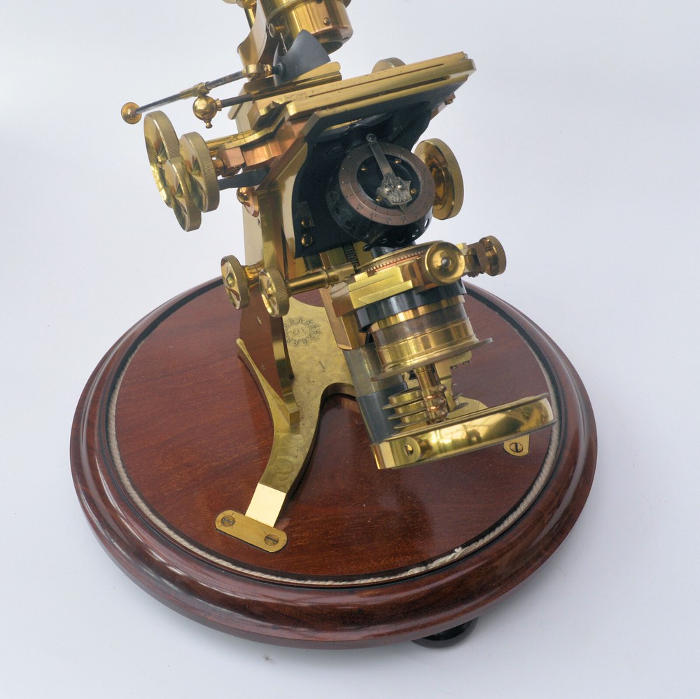 Very large binocular microscope in case with accessories.