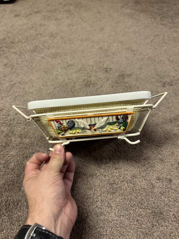 rooster-themed ceramic baker with a wire carrier