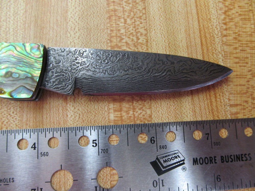 Custom Damascus folding knife. Abalone and gold leaf handles