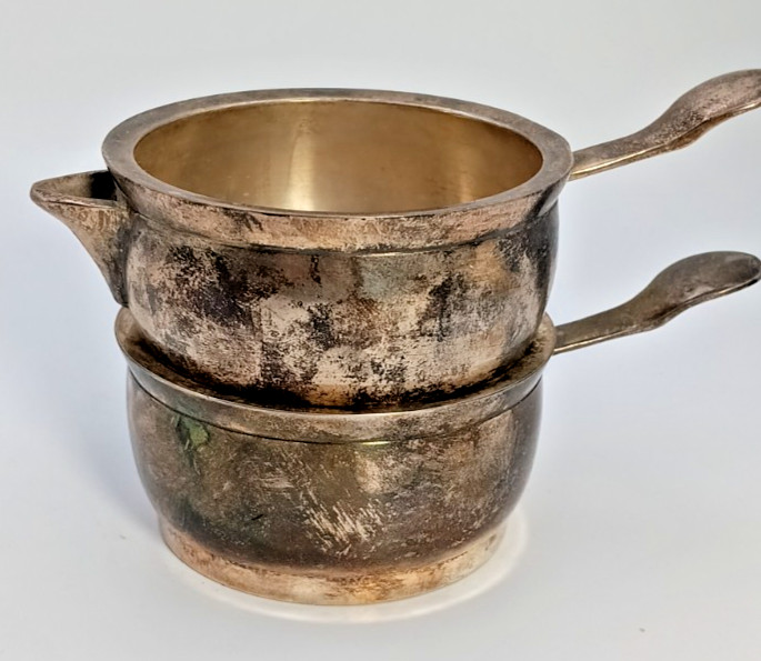 Silver plated stackable creamer and sugar set .