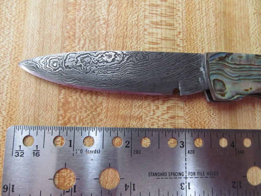 Custom Damascus folding knife. Abalone and gold leaf handles