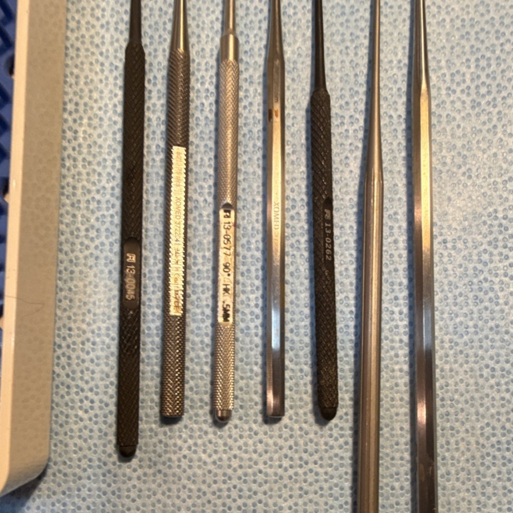 Seven piece otologic instrument pick set with case.