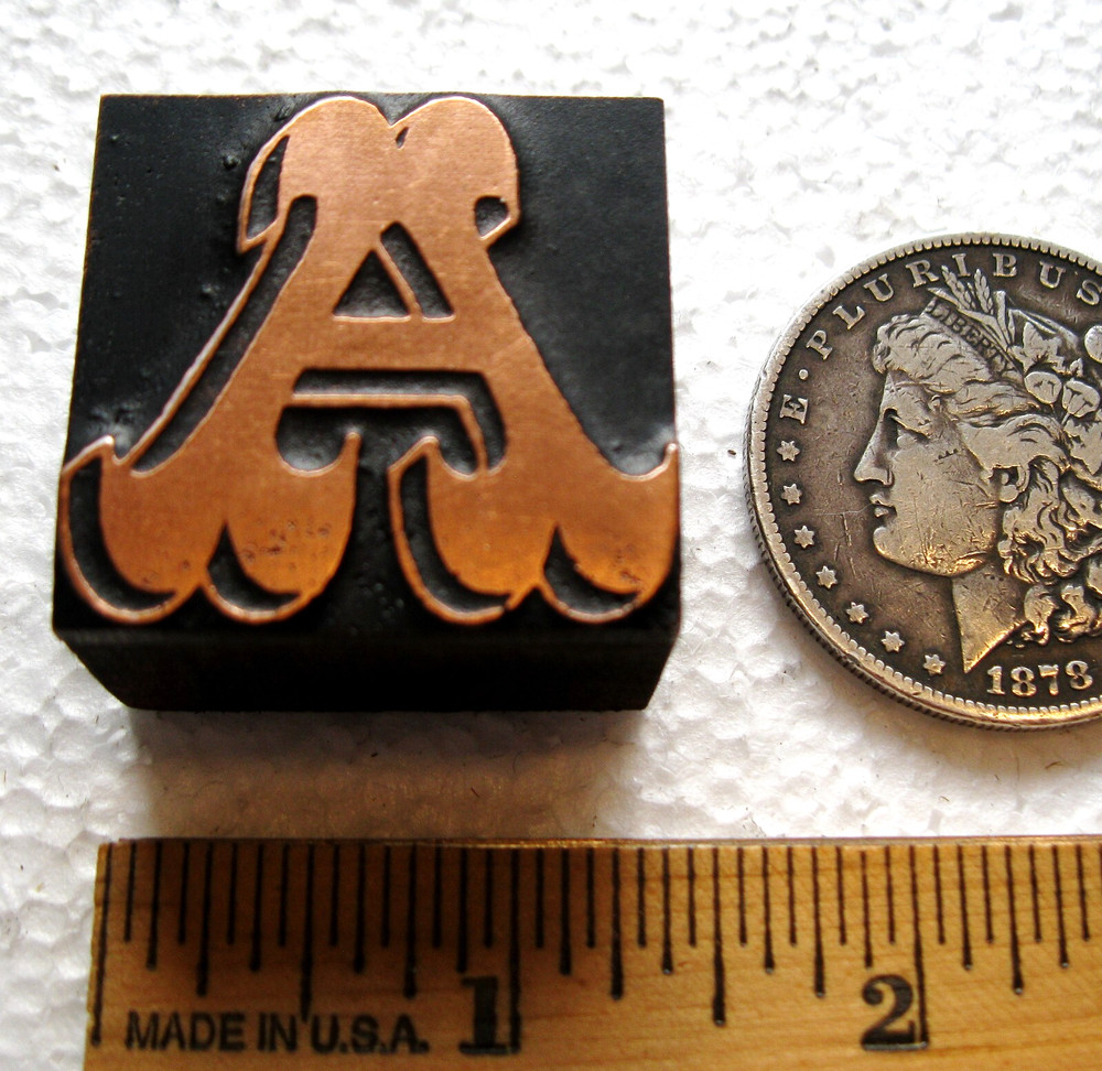 Copper faced ornate letter UC A