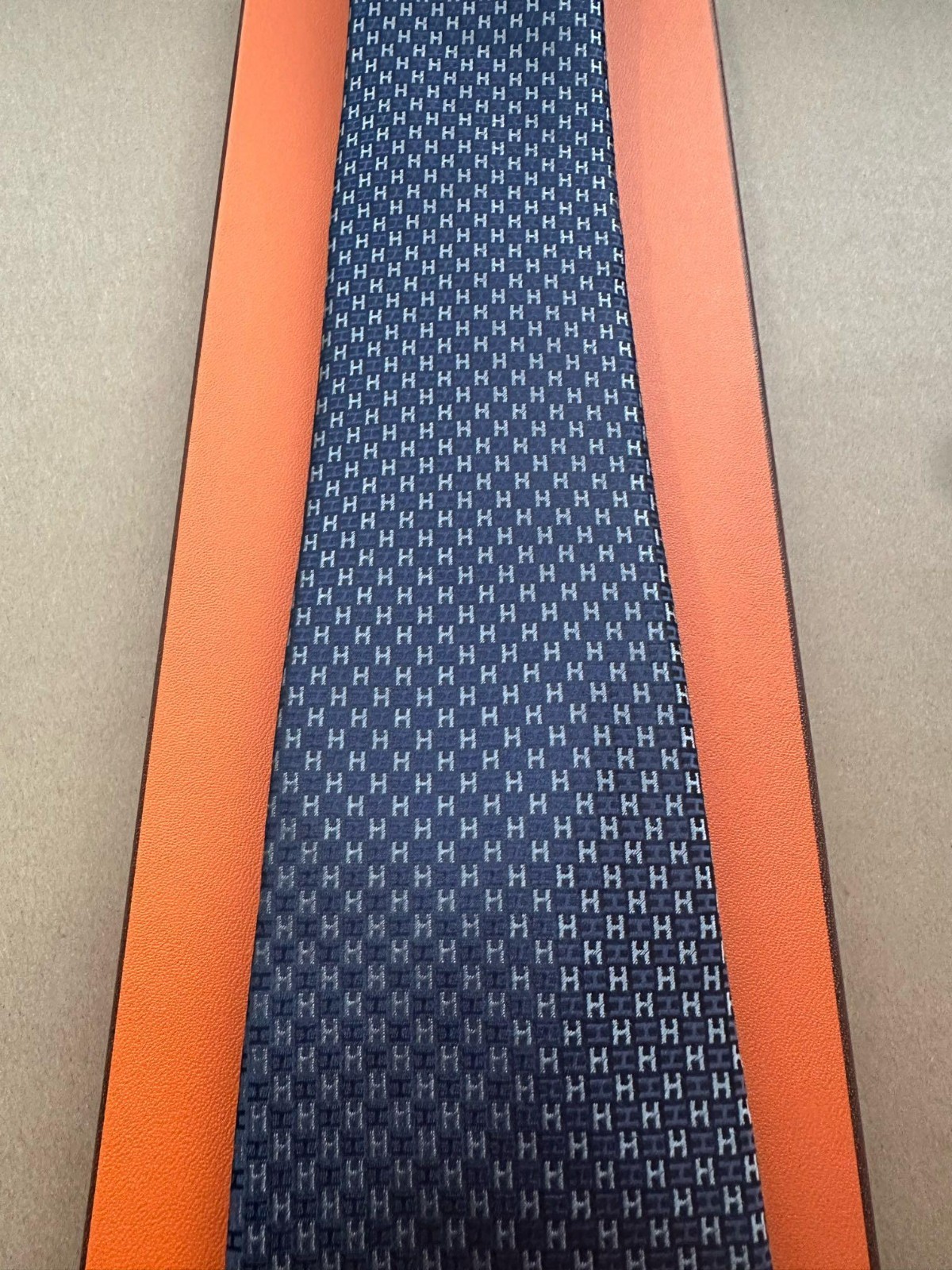 HERMES BLUE SILK TIE -- ALL OVER H MONOGRAM JACQUARD