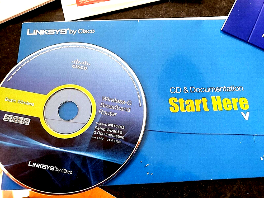 Assorted Software CDs & Logitech Manual (Windows 7, Word Perfect & Linksys)